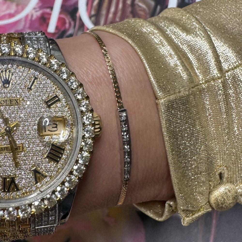 14k gold diamond bar bracelet featuring a delicate gold chain and a central bar